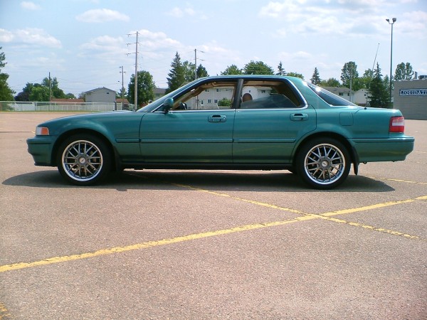 The Hammer. A 1994  Sherwood Green Metallic Acura Vigor with GS w/17" Kyalami Hyper Black Wheels.