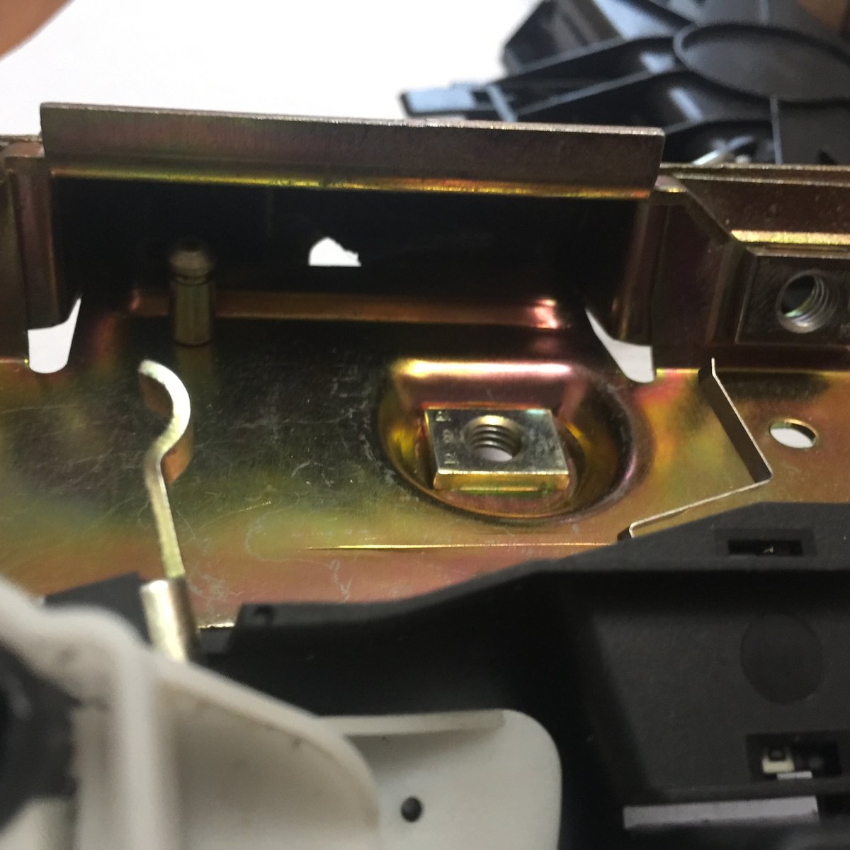 The micro switch is closed with a plastic piece on the latch mechanism