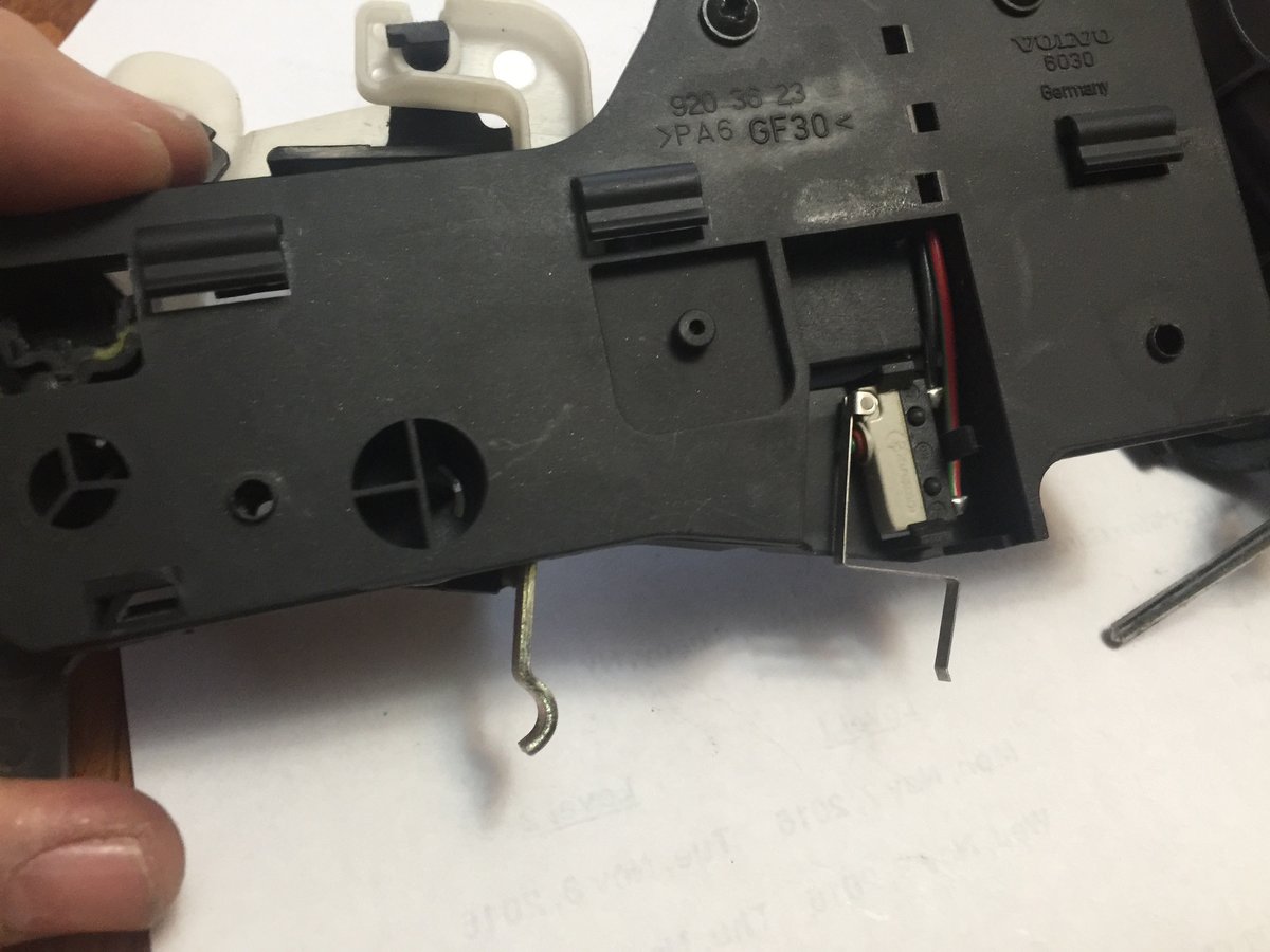 Metal latch removed showing release and micro switch for tailgate open light - switch CLOSED in this position