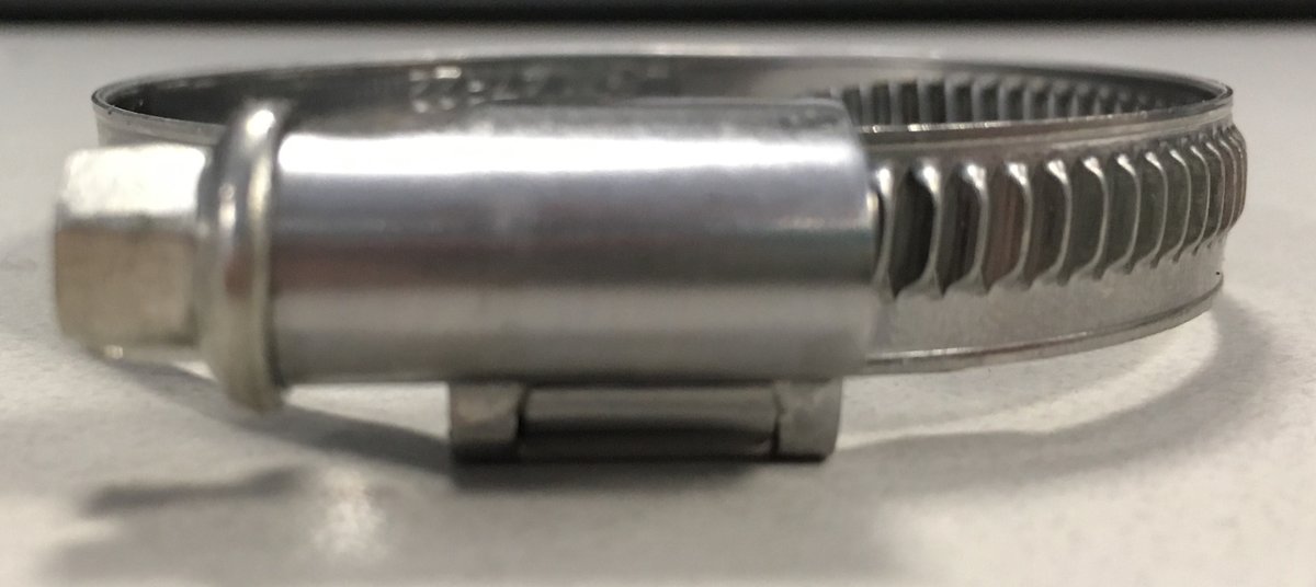 Front view of the new hose clamp, which has worm drive but with surface-mounted slots (no open slots in the clamp). It also has a side-mounted closure, as opposed to the other clamps that have a closure mounted underneath which creates another pressure point.