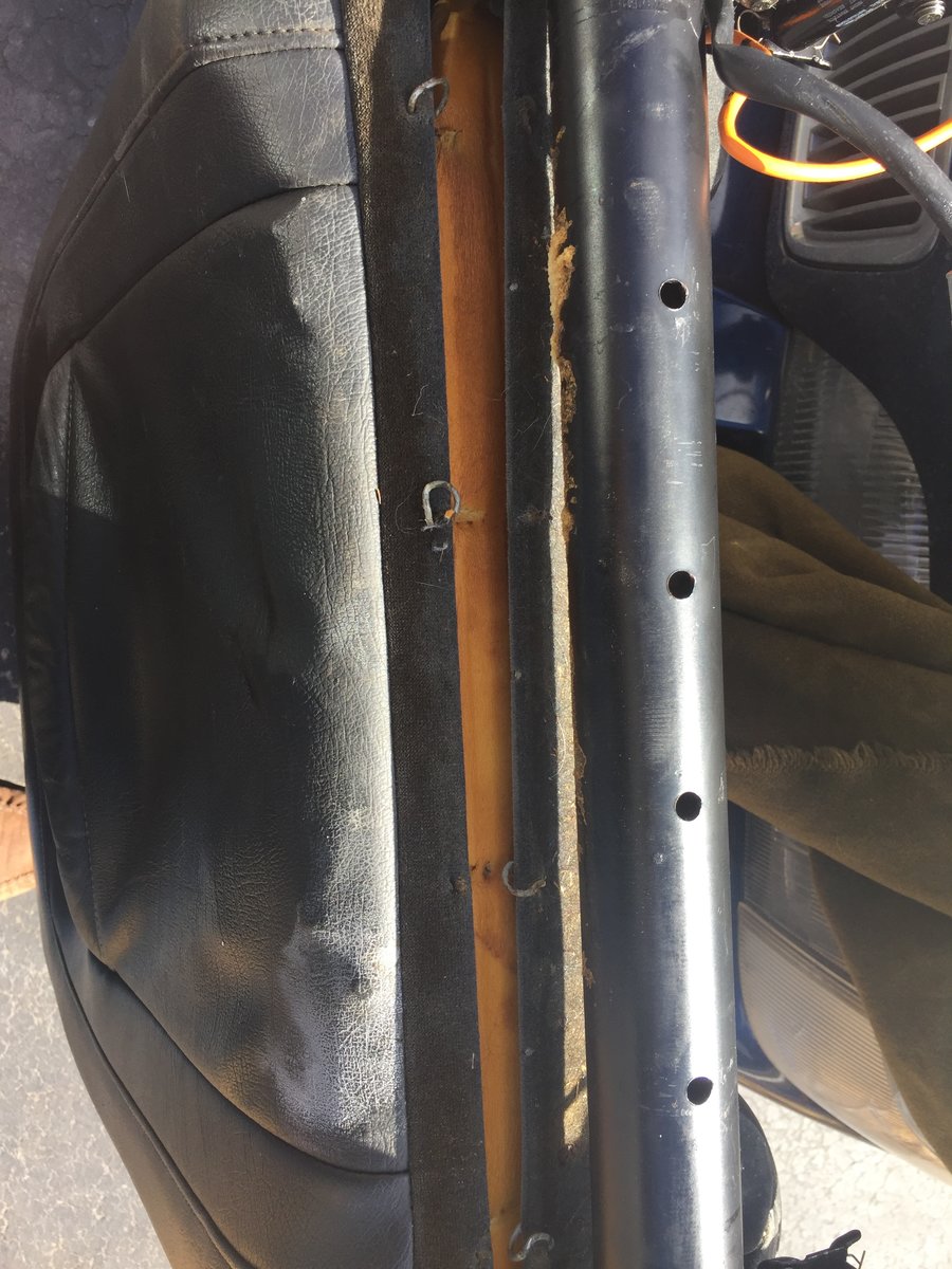 Opening bottom of seat back cover  - hog rings at bottom.