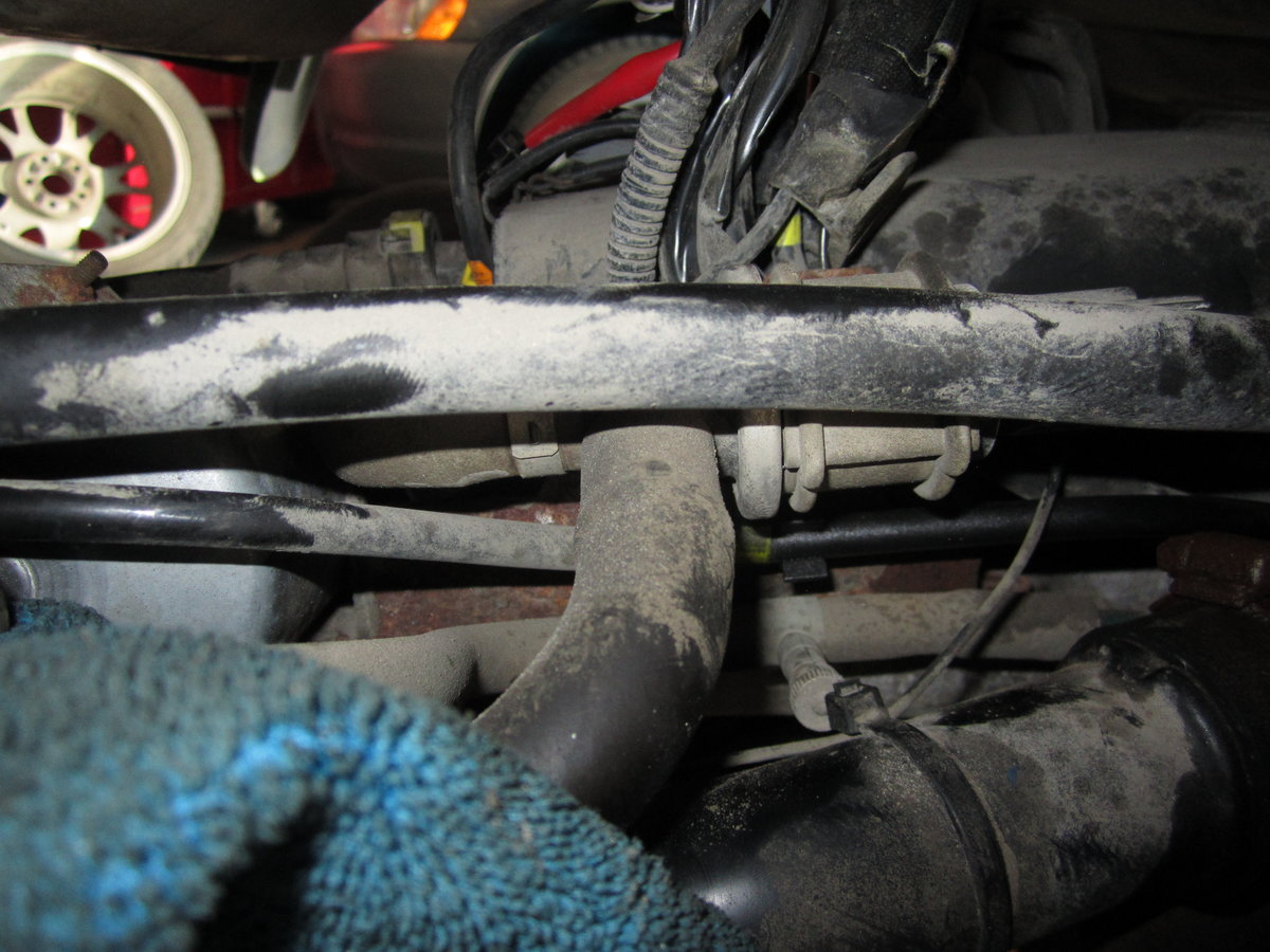 Pipe running up the side of the carbon canister