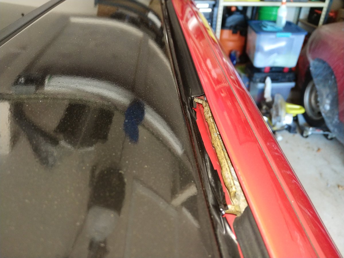 Under the roof trim where the roof rack gets mounted.