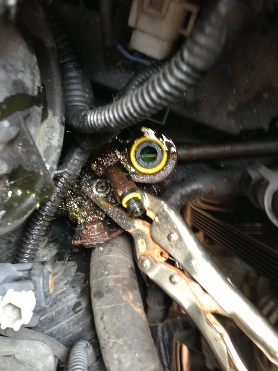 Ugly mess. The captive M6 in the frame member broke free, so I had to drill out the M6 to release the receiver. Chances of getting an old receiver out of car in place - near 0.