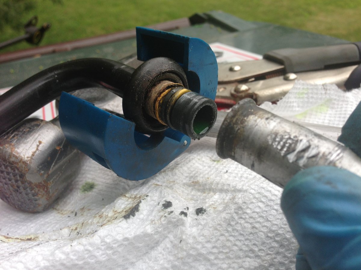 The tool expands that spring, which lets the trombone end slip out . Good luck  The aluminum corrodes the steel making it tough to twist and break free. Cut the evap and save an hour of swearing.