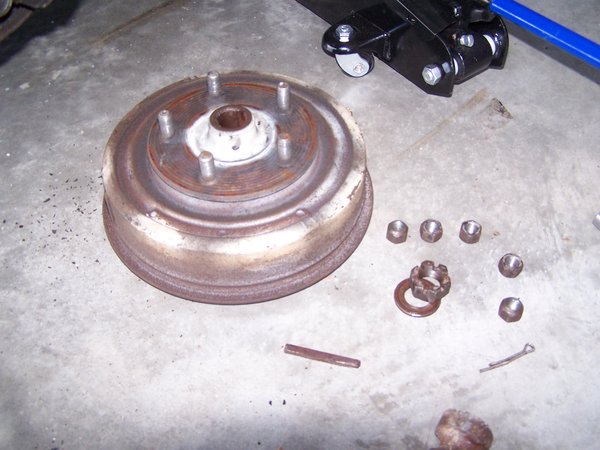 After removing the big keeper nut on the outside, a small whack with a hammer brought the hub loose. I was happily surprised it came off so easily. I've heard of some horror stories where beer, swearing, and a torch were required.