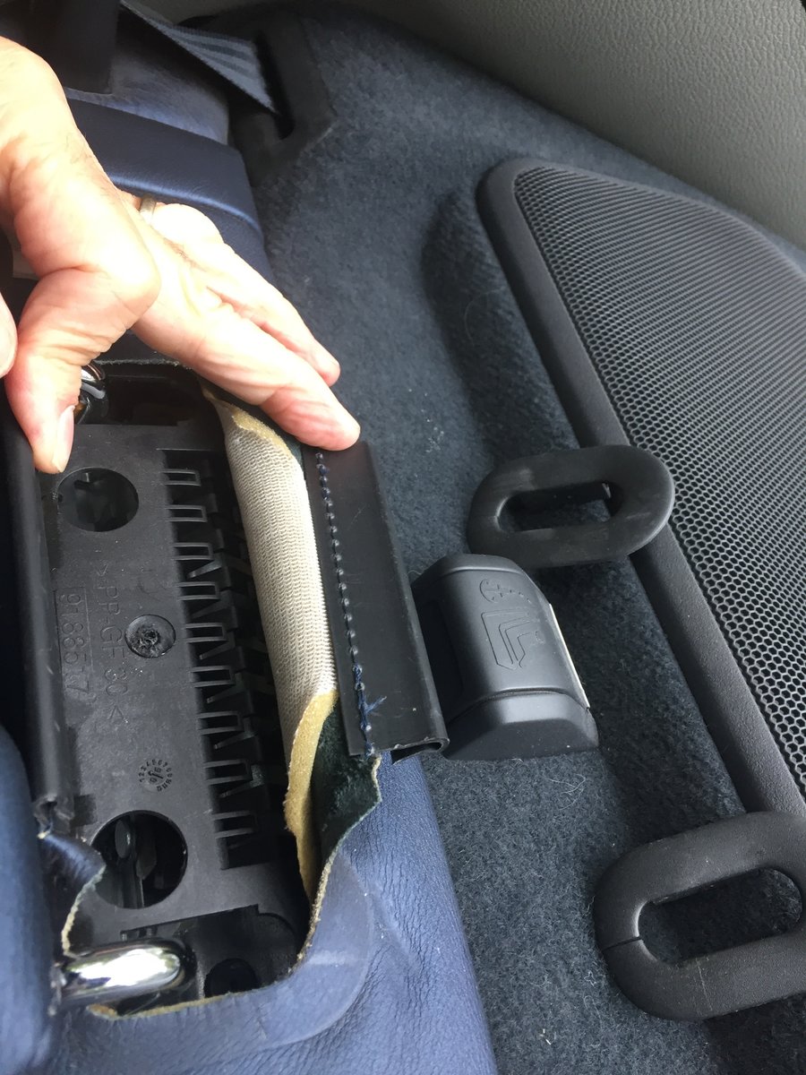 seat leather opened up, ready to apply lube to the latch