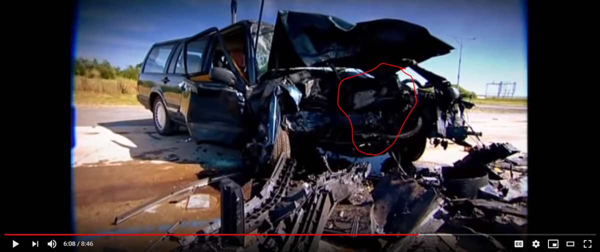 Screenshot showing engine bay of crashed car