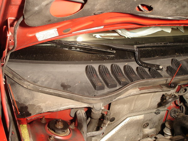 I remove two of the three bolts to take a look.