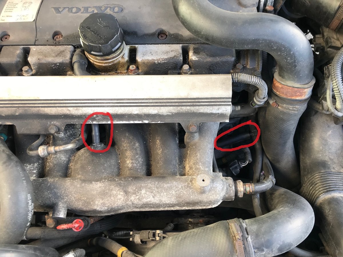 engine photo with hose circled in red