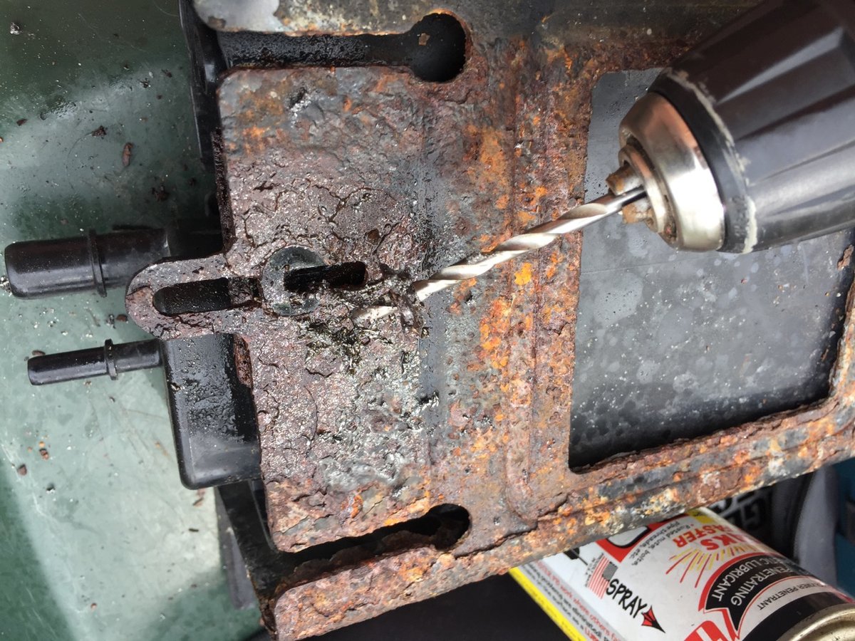 I had to drill out the Torx holding in the EVAP CAN - this is a horrible bastard rusty POS