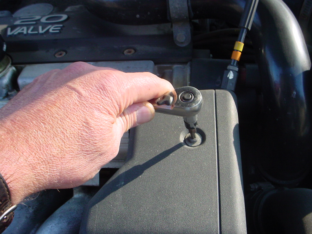 Removing the throttle cover.