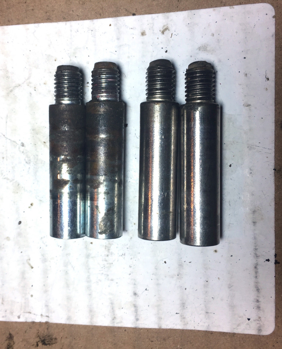 passenger side: rebuilt caliper pins (left) and 205k factory pins (right)