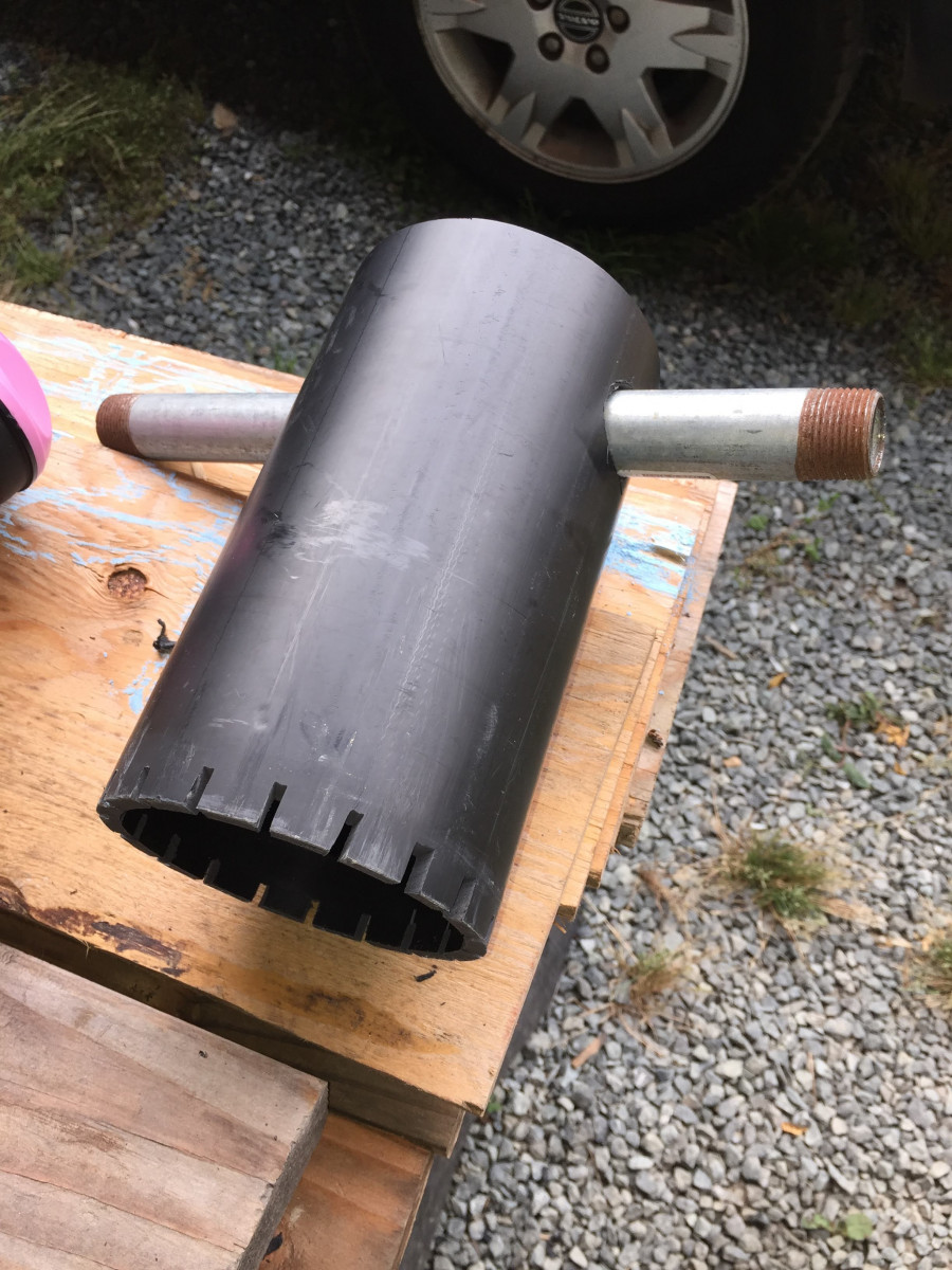 Homemade retaining ring tool. I marked the ring tabs with chalk, touched the end of the 4-inch ABS to the ring, then cut single kerf slots with my table saw.