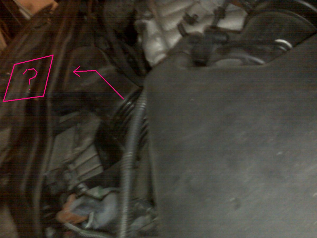 The tube from the air filter box goes towards the grill but a gap in the tubing about the size of the pink box exists above the radiator.