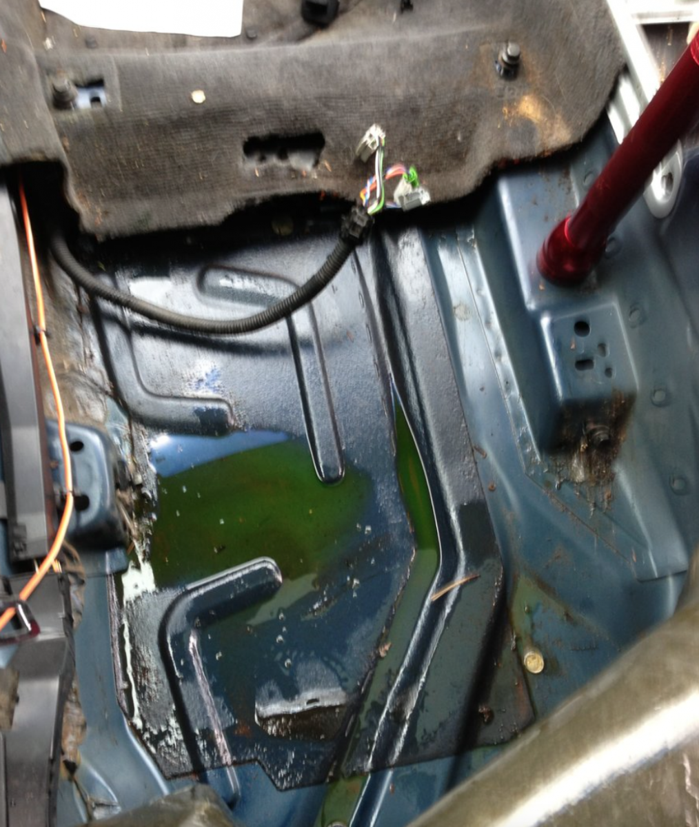 Ugly coolant mess under rear driver seat from leaking heater core