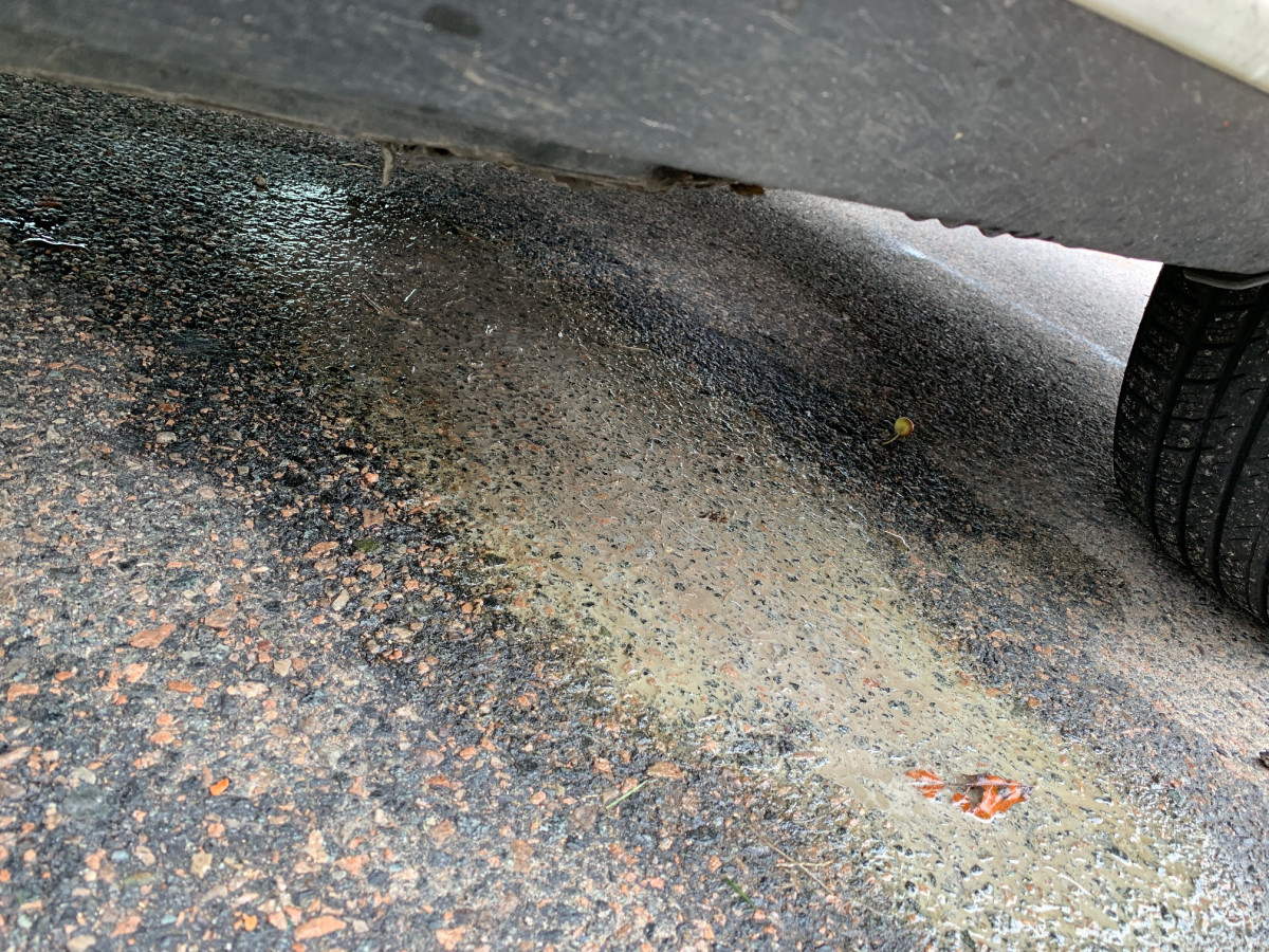 Puddle under car after pouring a gallon of coolant in