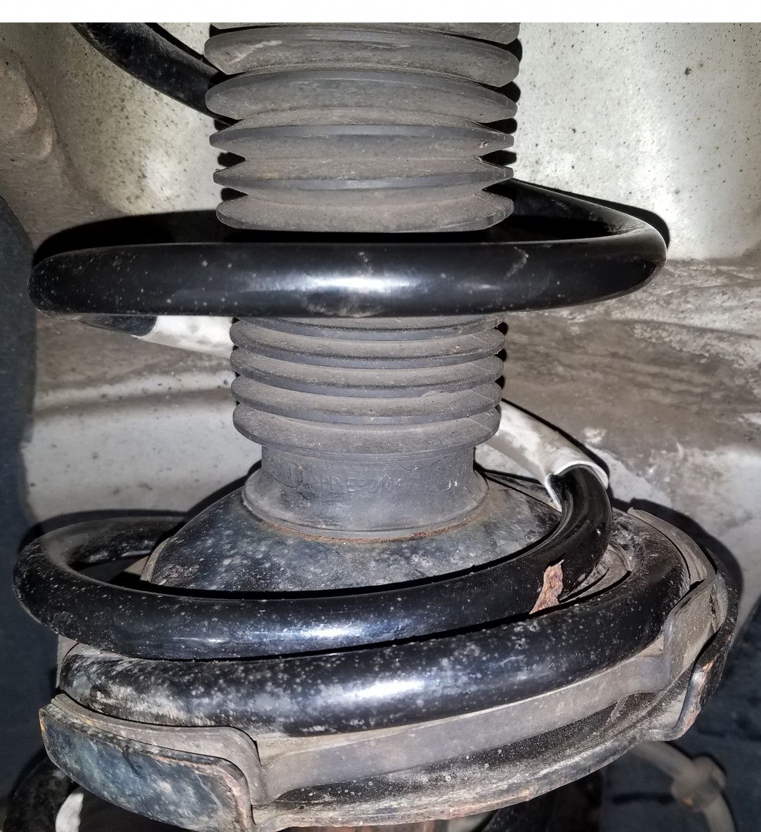 Broken spring piece in place.