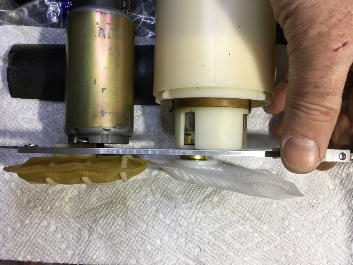 pumps side by side and aligned. new one in assembly. filters now about same distance from pump.