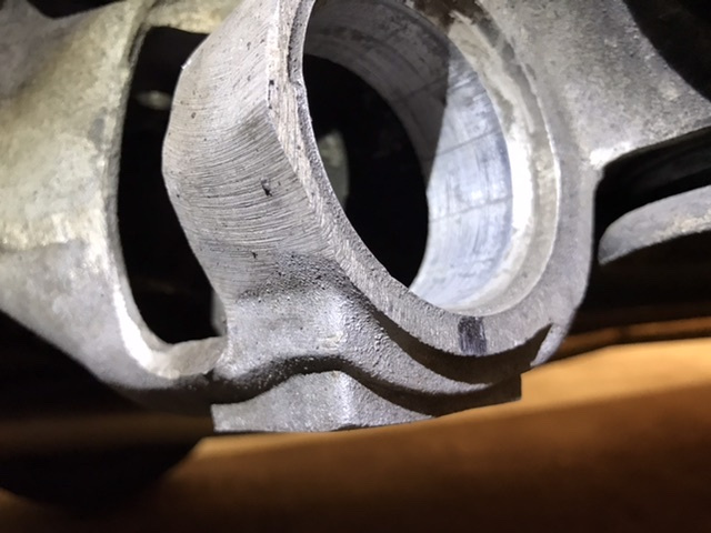 Out. Clean up the hole, I used a wire wheel very lightly. Then a light coat of grease or dishsoap to ease pressing the new one in. Note the sharpie mark - you'll want to mark the orientation of how the originals come out so the new ones can go back in close to that.