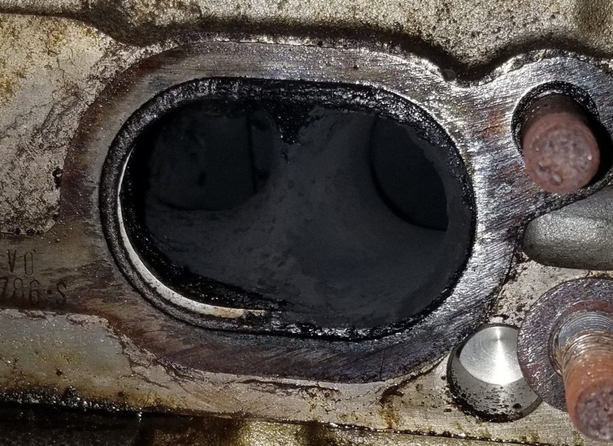 Failing valve stem seal on the left