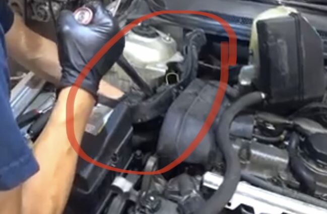 Once wire loom is freed you can get your torque wrench/breaker bar between the loom and strut tower