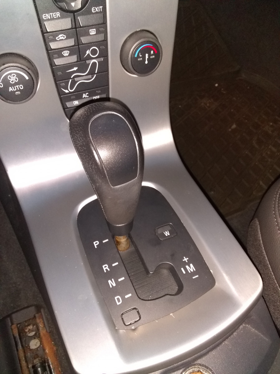 The blind was broken under the shifter rod.  Lookin fresh now  !