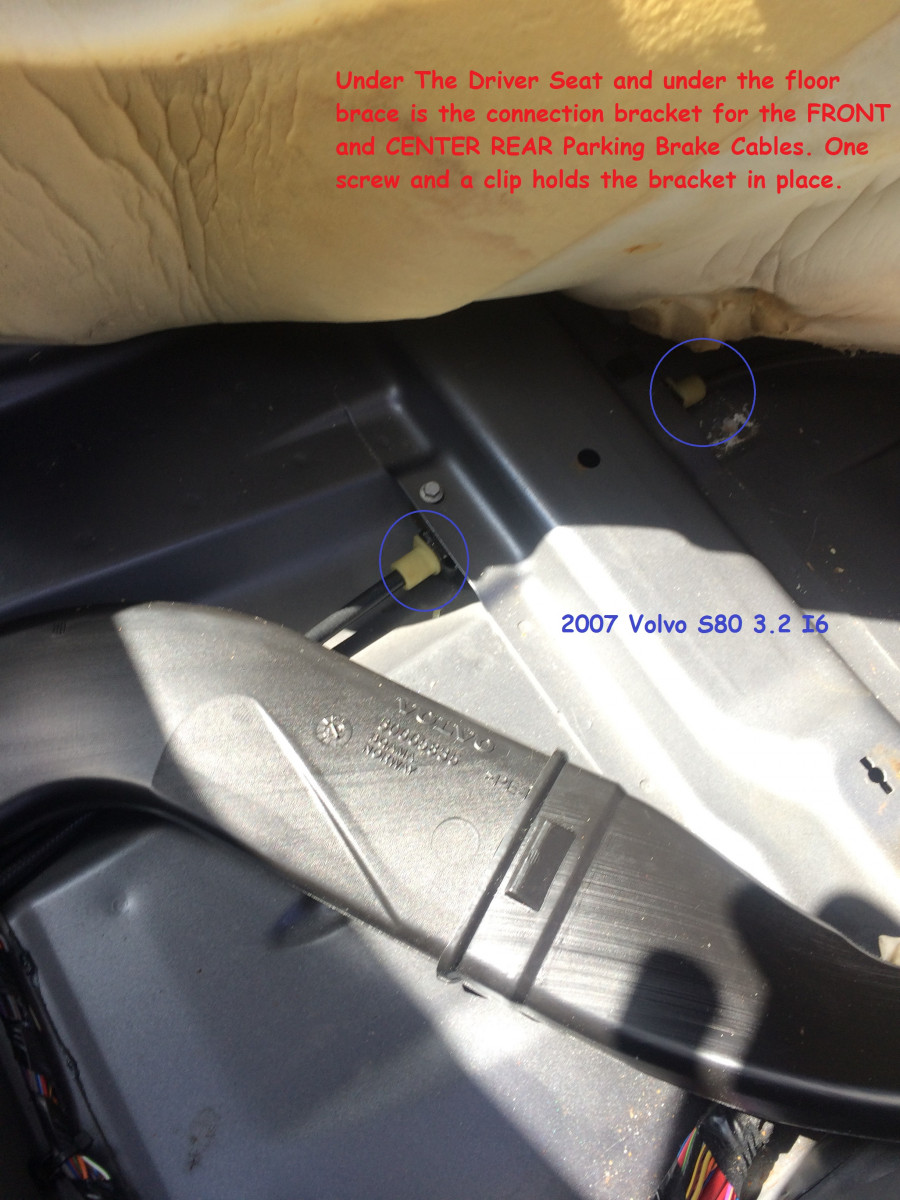 Directly under driver seat, front and center rear cable junction and coupler bracket