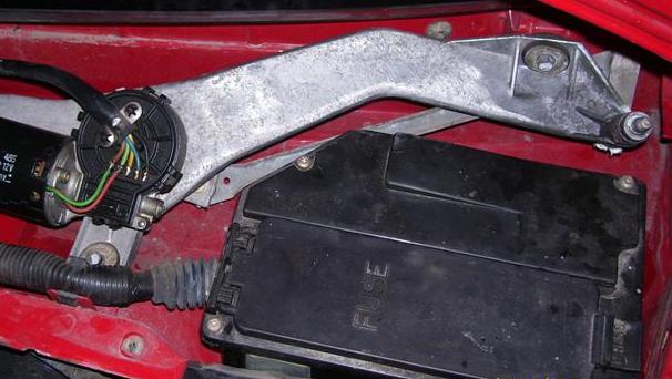 Wiper assembly showing two mounting bolts.