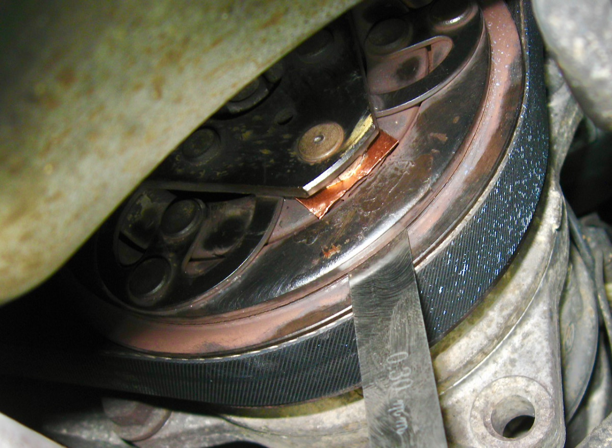 Copper shim installed, measuring gap at just above 0.3mm.