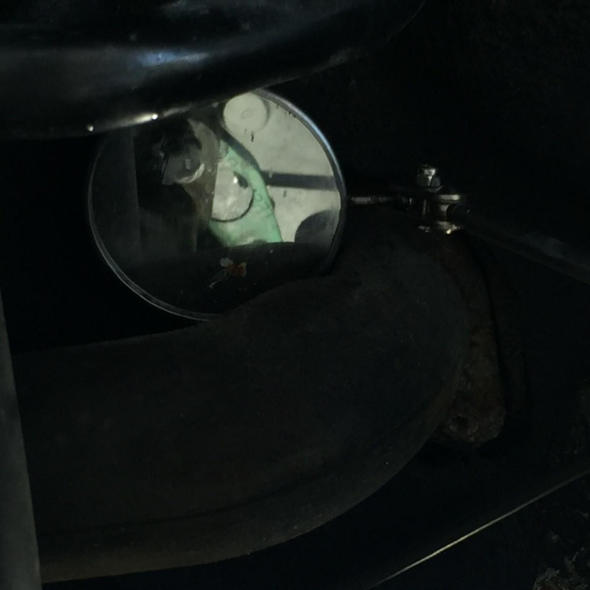 With the stud out, you caN easily ease the gasket in until you see the hole align