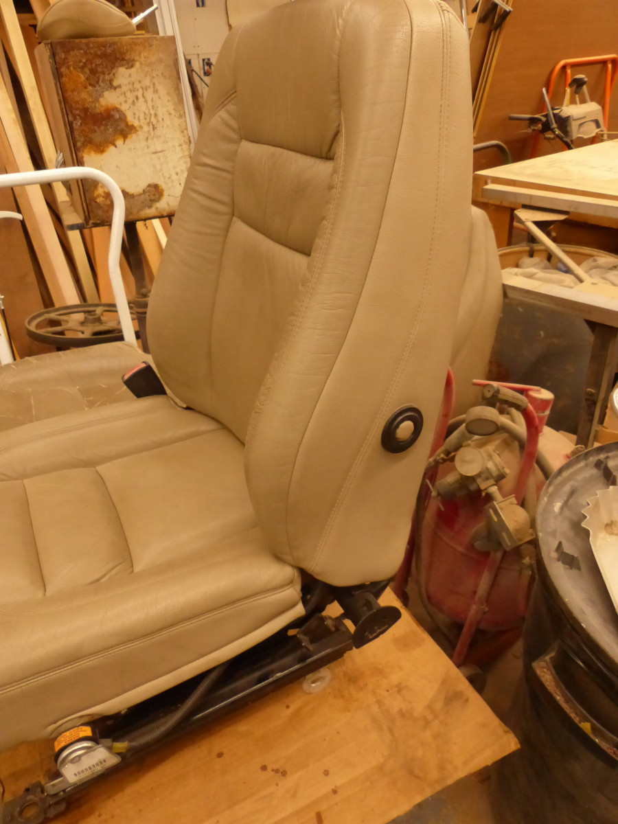 To cover the old lumbar adjustment knob I used its ring, then took a short piece of 5/8" dowel rod, glued a piece of the side vinyl from the old seat then glued that in the ring.