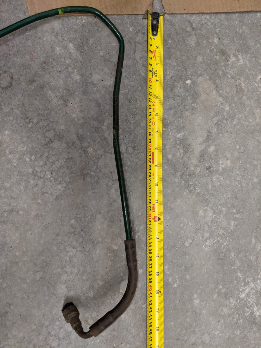 Section of return pie on LHS of fuel tank top