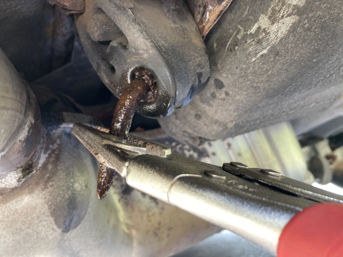 Twist out old rusty bracket stub.