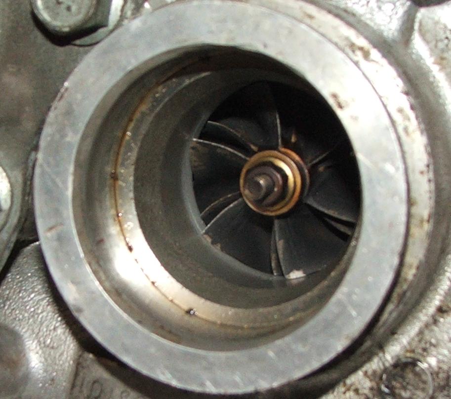 Turbo 2 compressor side. Looks like contact with the housing? I wasnt able to make it contact by hand...I wonder if a temporal drop in oil pressire may have caused this?
