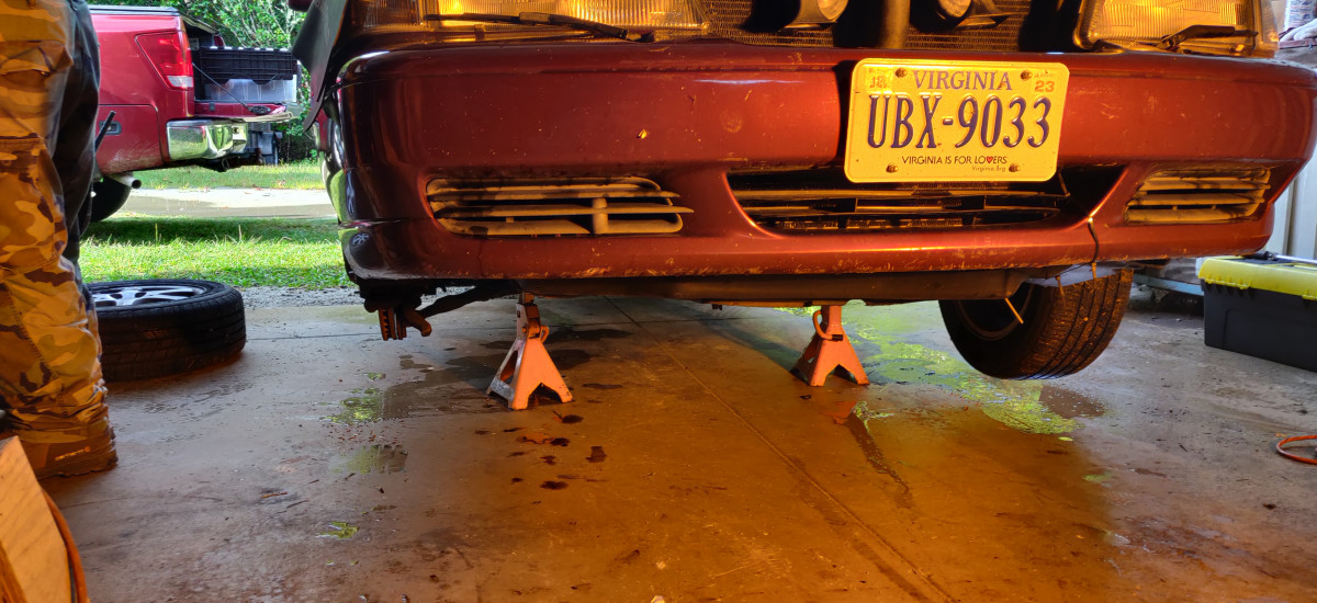 Jacked up and chocked back wheels