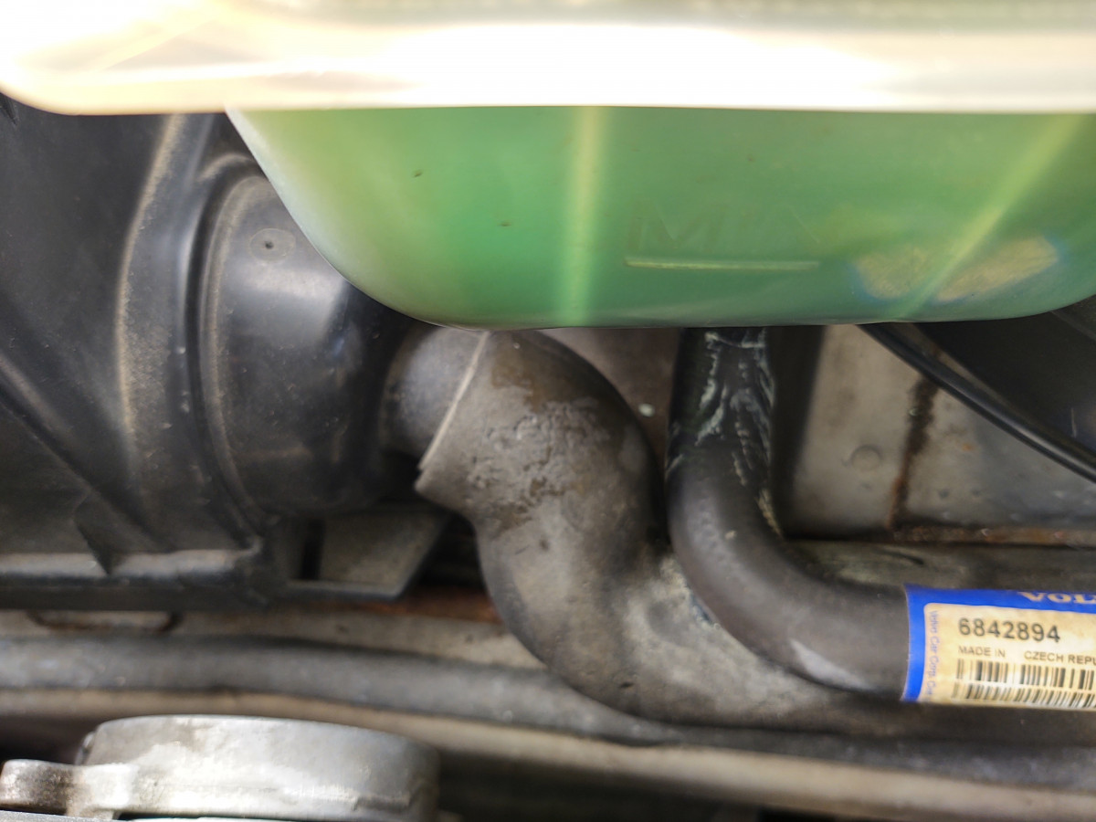 Found leak during oil change; old coolant tank and old coolant hose