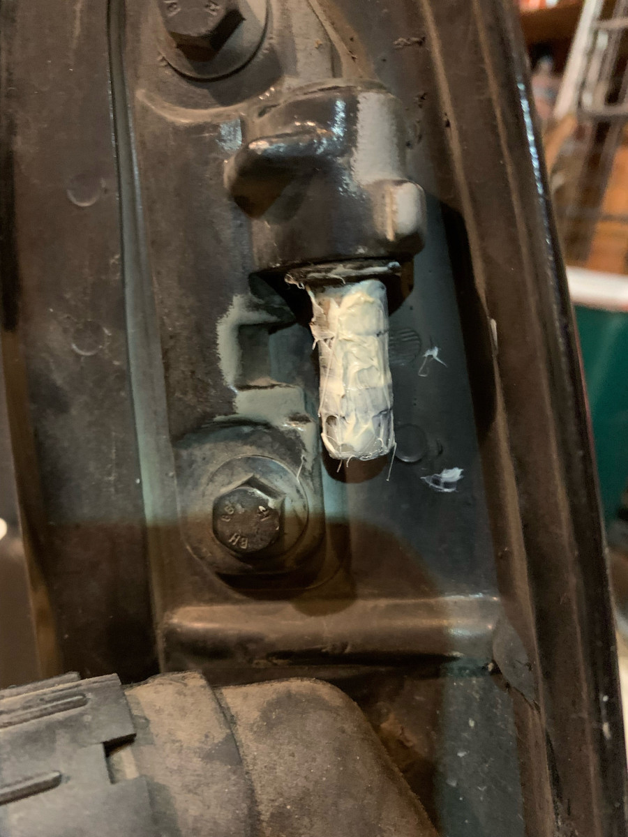 grease hinge pin on door