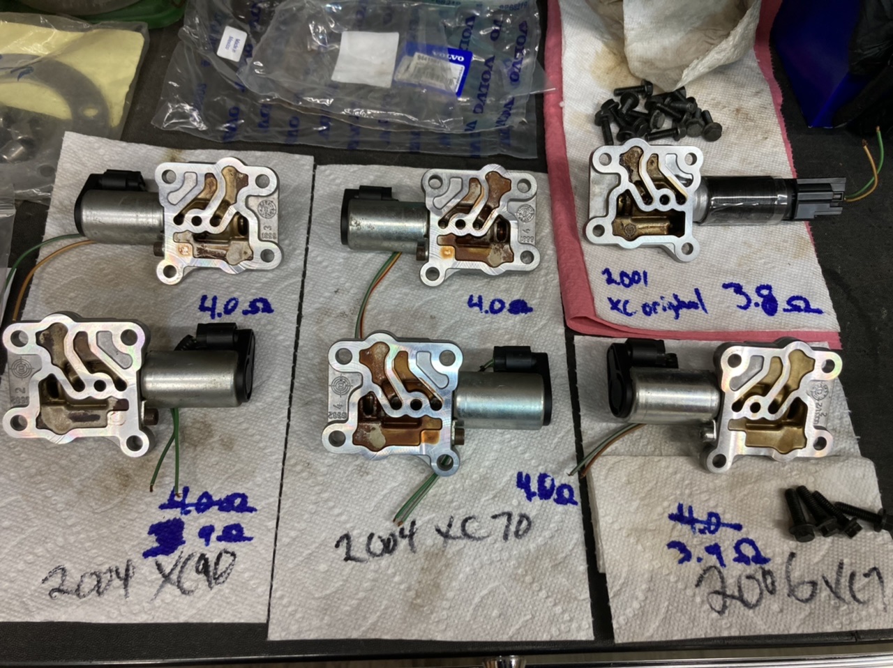 The original “non-serviceable” VVT solenoid is top-right in the photo.