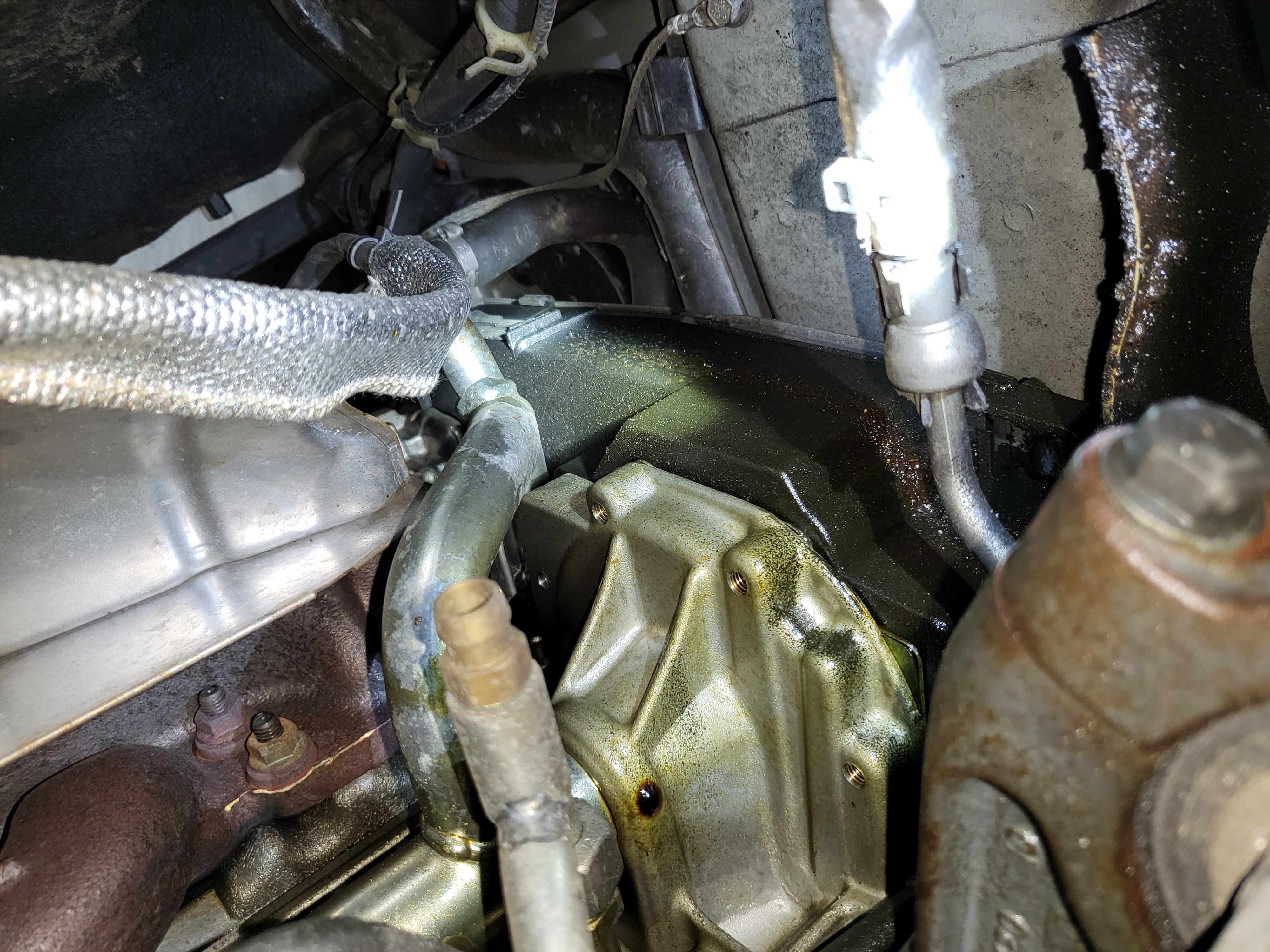 It seems to be leaking from up there. This would be the front/right corner of the engine (near the passenger wheel)