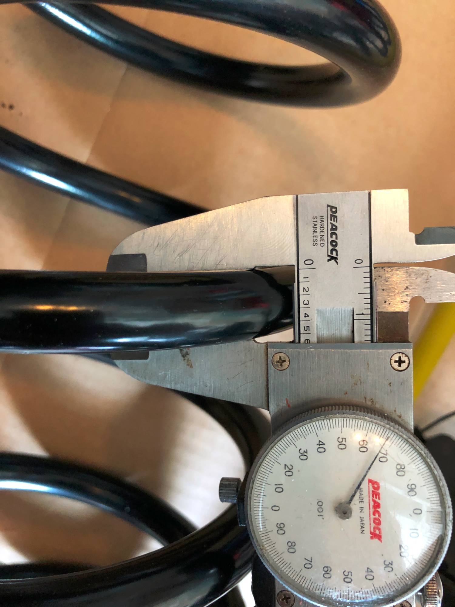 thickness of new aftermarket spring which is the same as oem spring