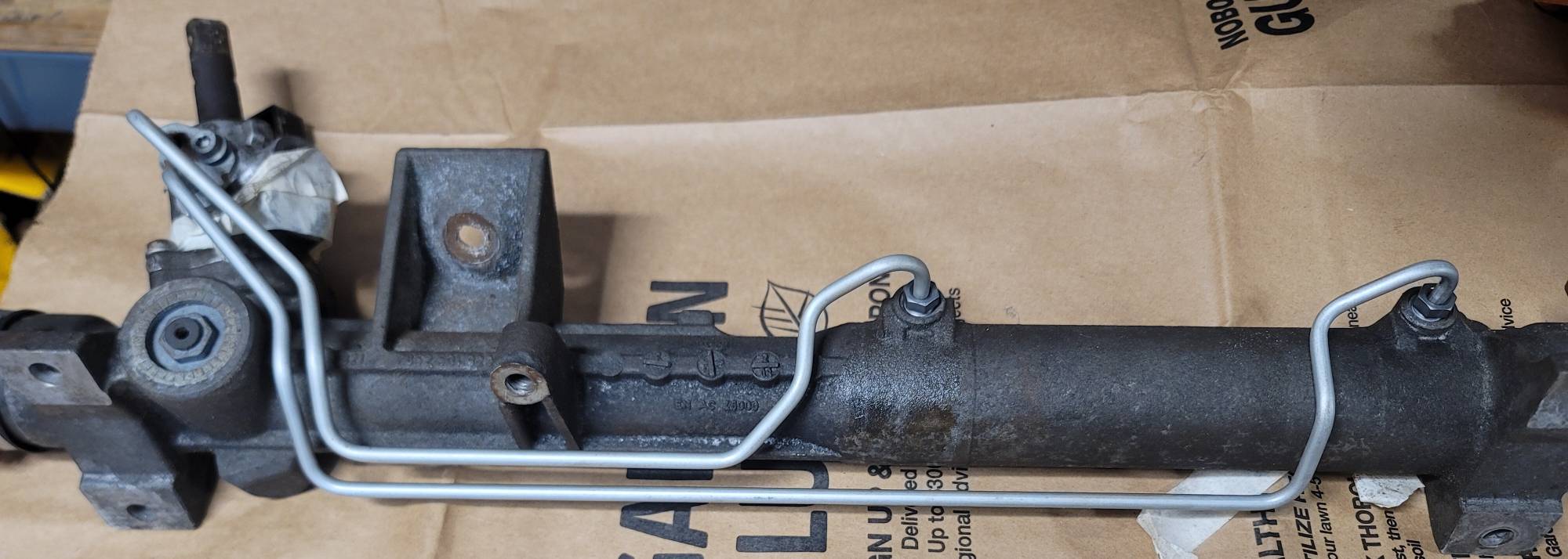 New hard lines loosely installed in the original rack.