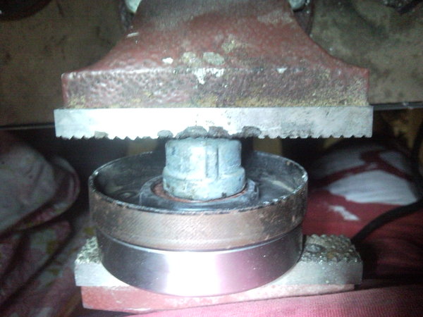 Squeeze the bearing out with a vice (I used a plumbing cap &amp; a large bearing on the other side)