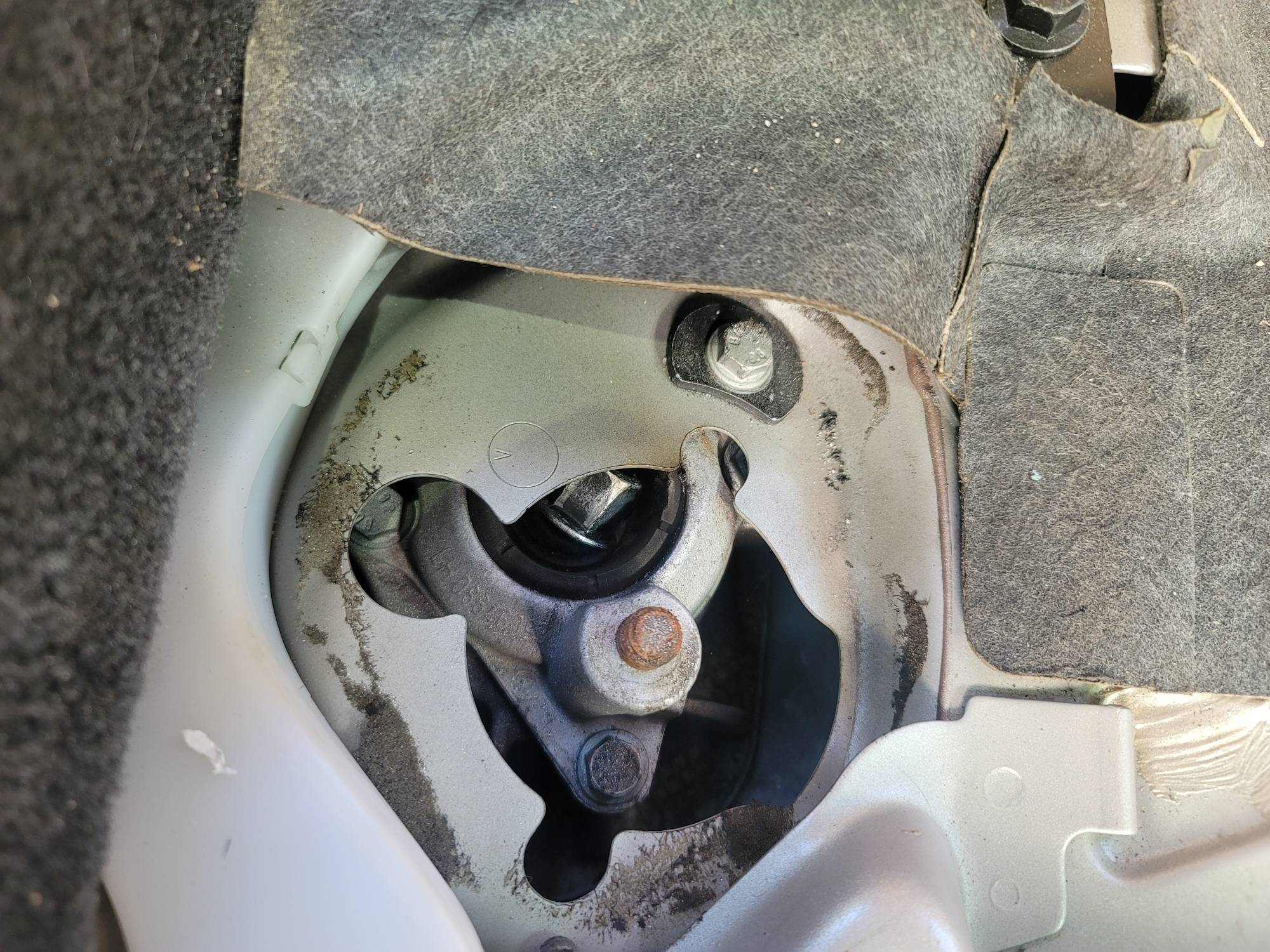 Loose upper shock bolt from interior