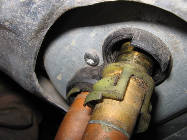 Work the pipe out while sqeezing lugs - came out with no difficulty.