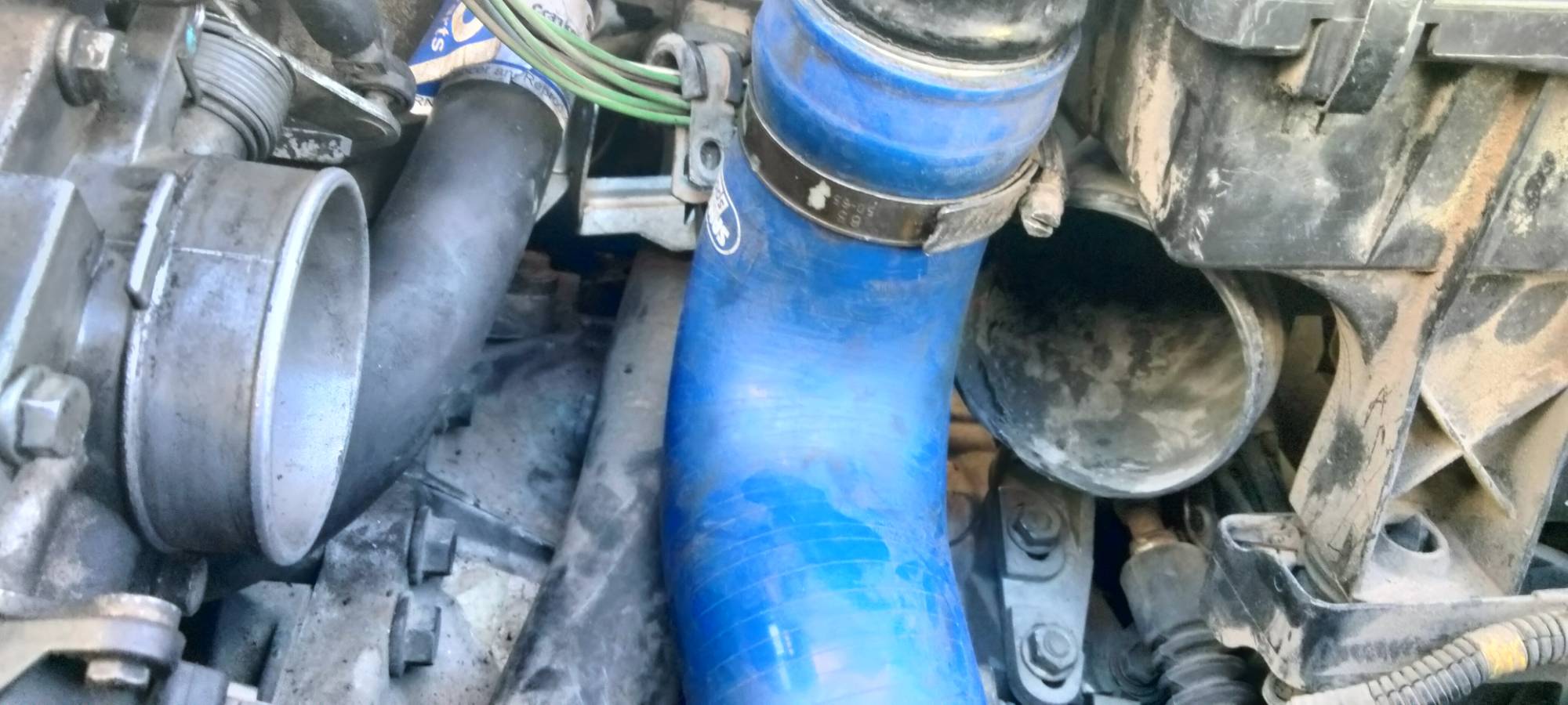 Bottom of air box right next to the throttle body