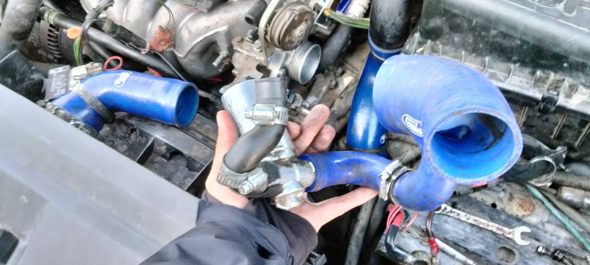 This is a piece that comes off the throttle body and goes into bottom of airbox, the little hose goes into the idle control valve