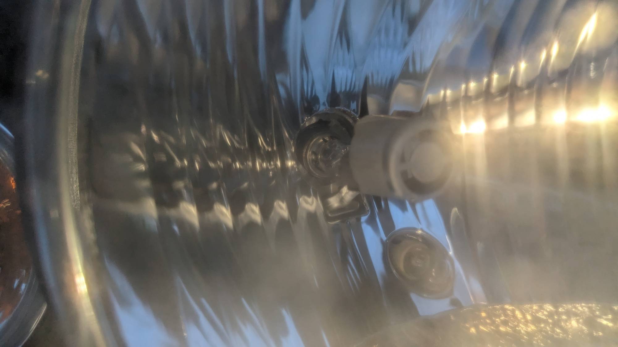 It's hard to see, but if you do an extreme close-up you'll see that it's being held by one tooth.