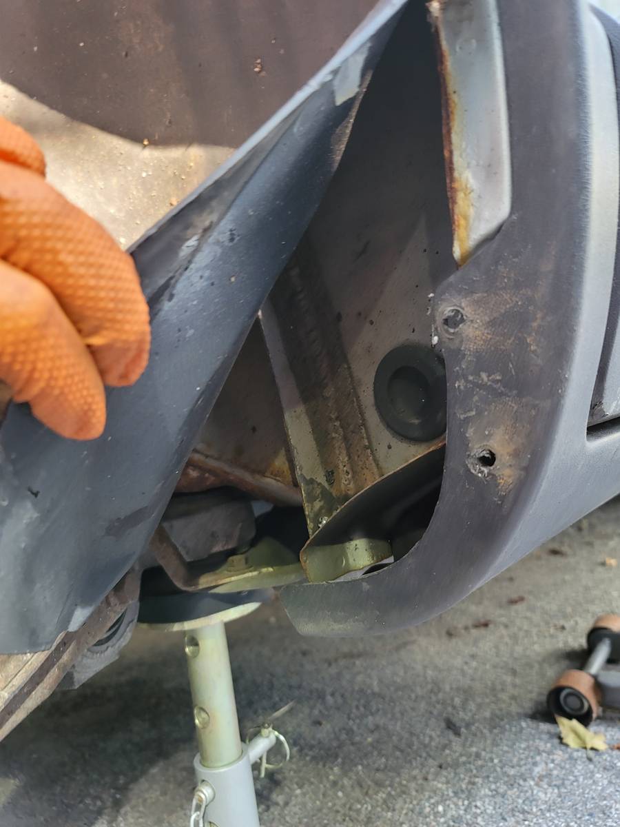 behind right rear wheel well line