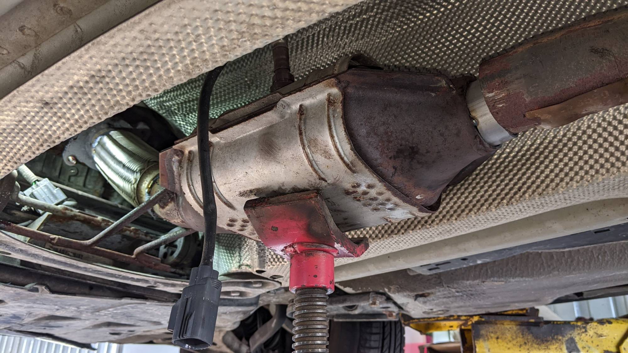 Re-attaching the cat to the new downpipe/flex pipe.